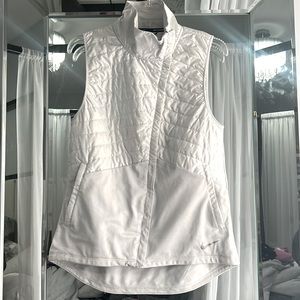 Nike Running Vest/color is white but it has a light gray tint to it. Dove gray